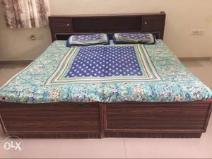 Double wooden bed with ample storage along with