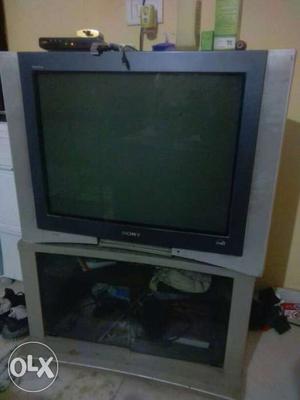 Gray CRT TV; Gray Wooden TV Rack