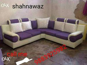 Purple and white tufted sofa