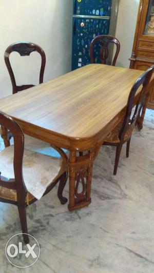 Rectangular Brown Wooden Dinning Table With Four Chairs