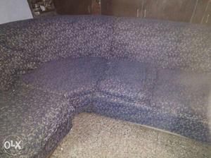 Six sitter round sofa in good condition with cover