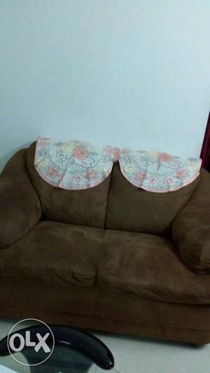 Three+Two Brown colour sofa of Godrej brand in a