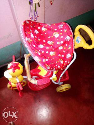 Toddler's Pink And Yellow Bicycle Stroller