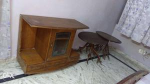 Two Round Brown Wooden Tables And Cabinet