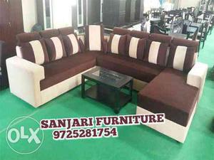 White And Brown Sectional Sofa With Pillows