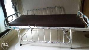 White Semi-electric Bed Frame With Brown Mattress