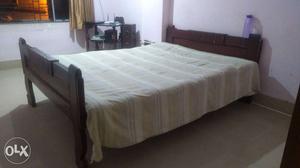 Wooden Bed with 2 mattress. good condition.