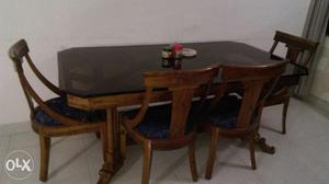 Wooden dining table with 5 cushion chair