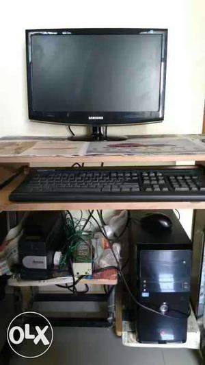 Black Computer Tower, Flat Screen Computer Monitor, And