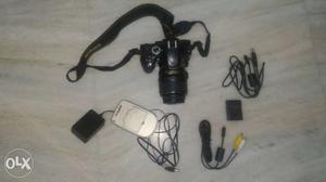 Black DSLR Camera With Accessories