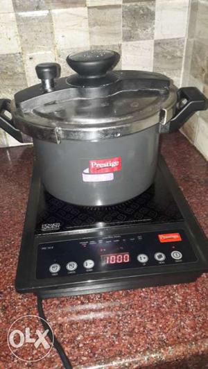 Gray Induction Cooktop And Pressure Cooker