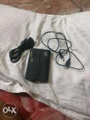 Rectangular Black Device With USB Cable