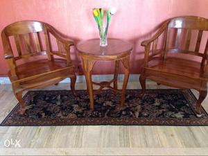 2teakwood chairs and a table from malaysia