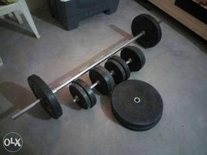 Black And Grey Metal Barbell And Two Dumbbells