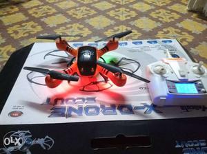 Red And Black Quad-copter Drone With Box