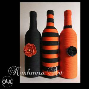 Three Black-and-orange Thread Covered Display Bottles