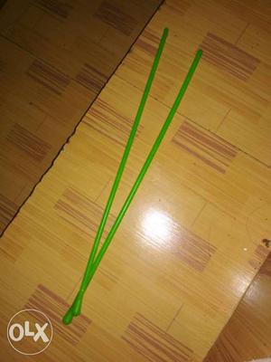 Two Green Plastic Sticks