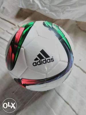 White, Green, And Red Adidas Soccer Ball