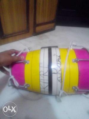 White, Yellow, And Pink Percussion Instriment