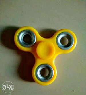 Yellow And Silver Hand Spinner