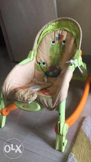 Baby's Beige And Green Bouncer Seat