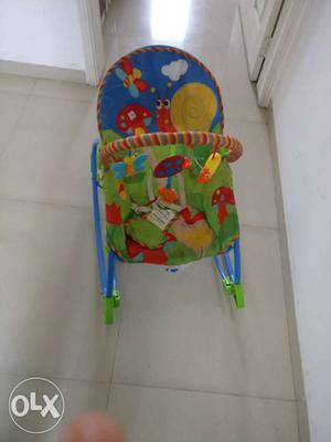 Baby's Blue And Green Bouncer Seat