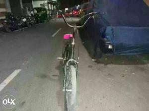 Black Bicycle With Pink Bicycle Seat