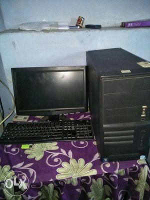 Black Computer Tower And Flat Screen Computer Monitor