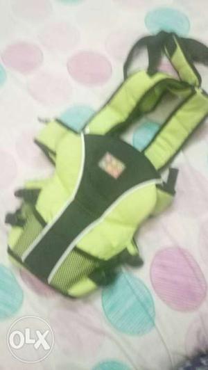 Green And Black Baby Carrier