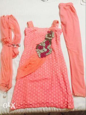 Pink designer suit with work on it..Suitable for M size