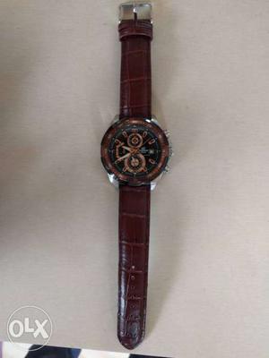 Red And Black Chronograph Watch With Brown Leather Strap