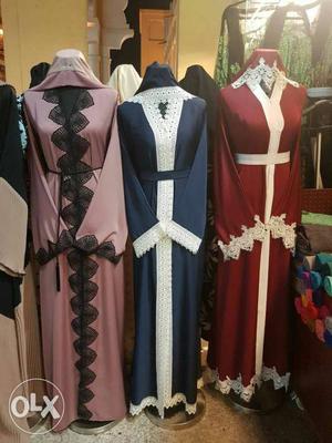 Three Pink, Blue, And Red Long Sleeve Dresses