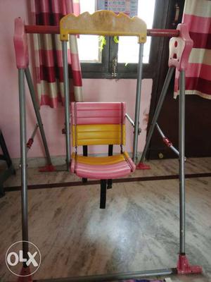 Toddler's Pink And Yellow Swing Chair