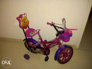 Toddler's Purple And Pink Bike With Trainer Wheel