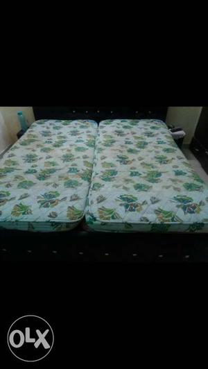 Two White-and-green Mattresses