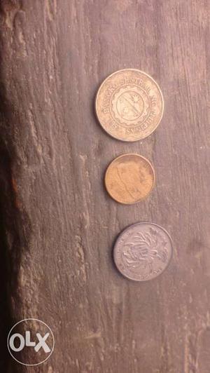 Three Round Silver And Gold Coins