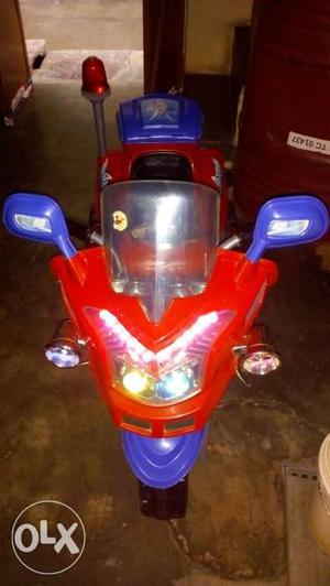 Toddler's Red And Blue Ride-on Motorcycle
