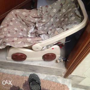 Baby's Brown And Beige Car Seat Carrier