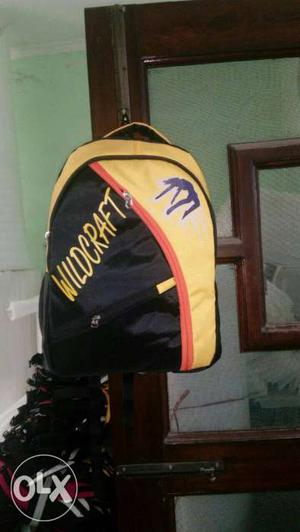 Black And Yellow Wildcraft Backpack
