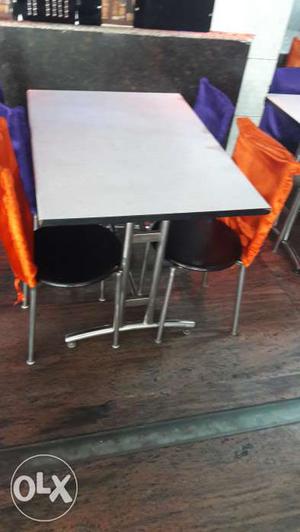 4 chairs with cover 1 table at 