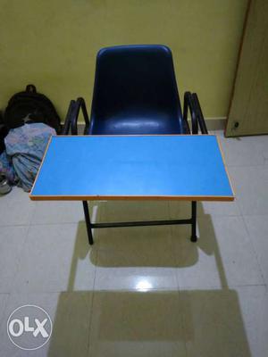 Blue Steel Armchair And Teal Rectangular Table