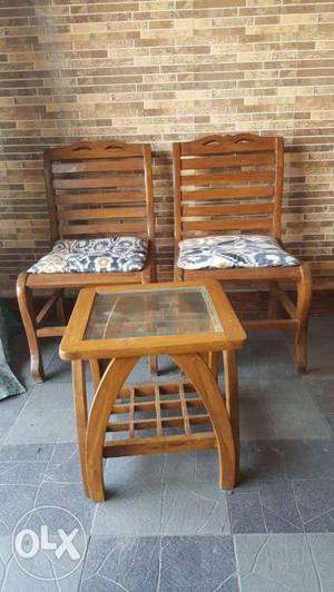 Brown Wooden Table With Armless Chairs