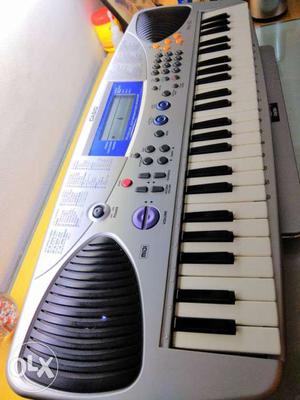 Casio keyboard MA-150 with charger and a