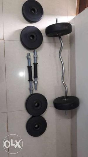 Curved Gray Barbell And Two Dumbbell Bars With six Weight