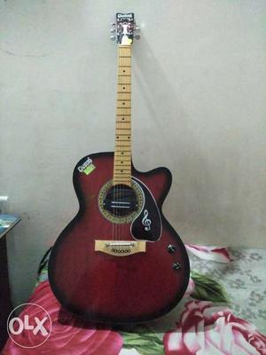Maroon And Black Acoustic Guitar