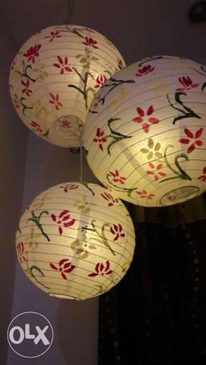 This a hand painted round paper lantern for room