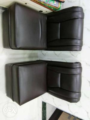 Two Black Leather Chairs