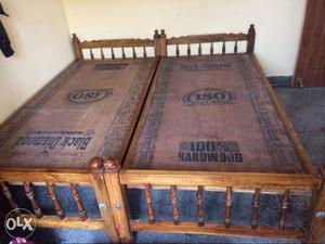 Two Brown Wooden Bed Frame