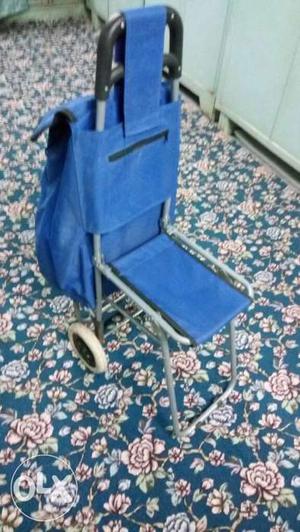 Unused luggage trolley with seat