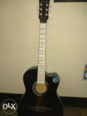 White And Black Acoustic Guitar